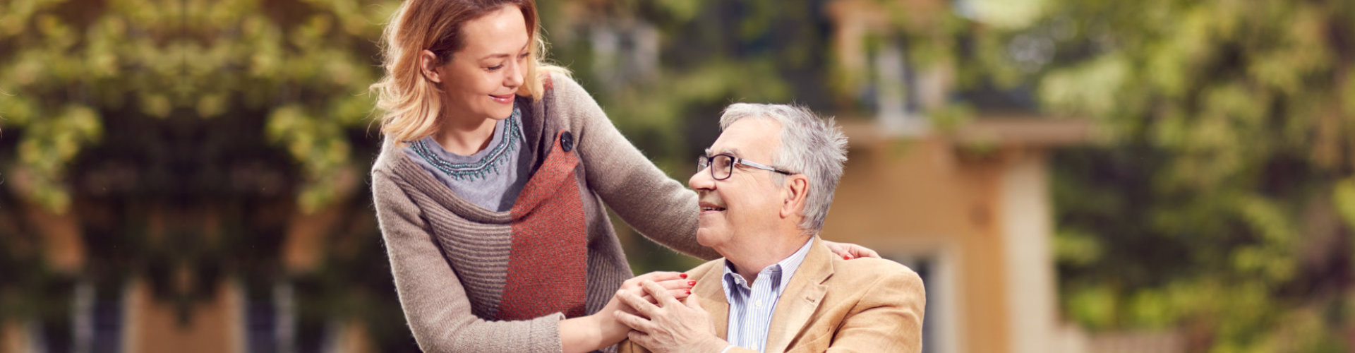 woman assisting senior man