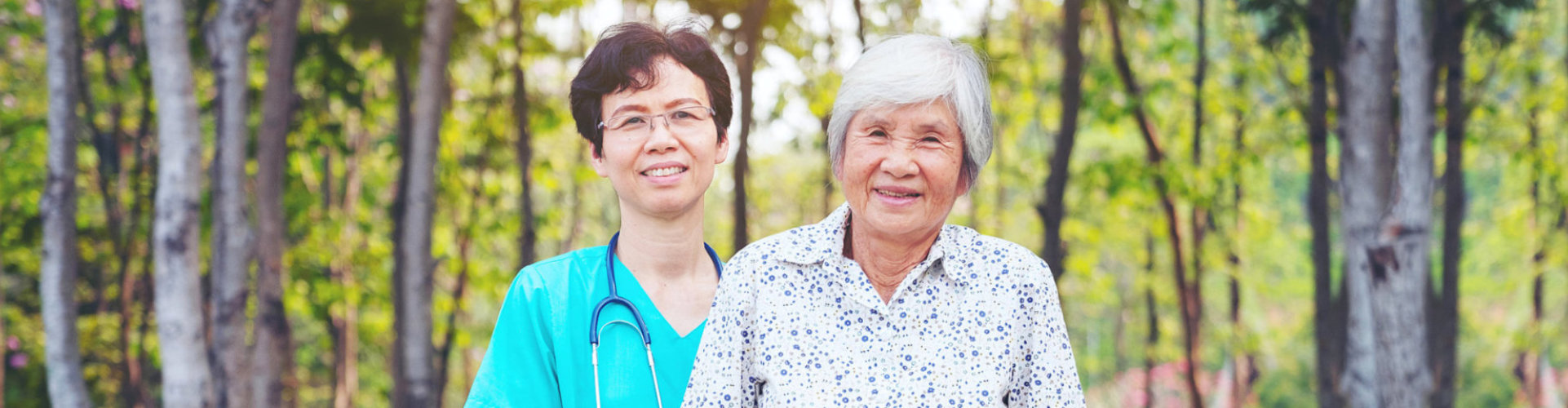 happy senior woman and caregiver